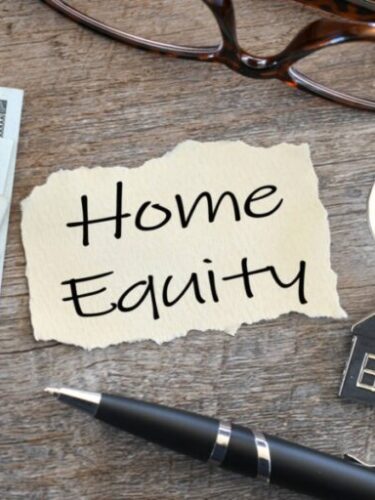 paper-that-says-home-equity-with-house-keys-calculator-cash-money-reading-glasses-and-ink-pen-flat_t20_QJg82G-e1656536578235-768x512.jpg