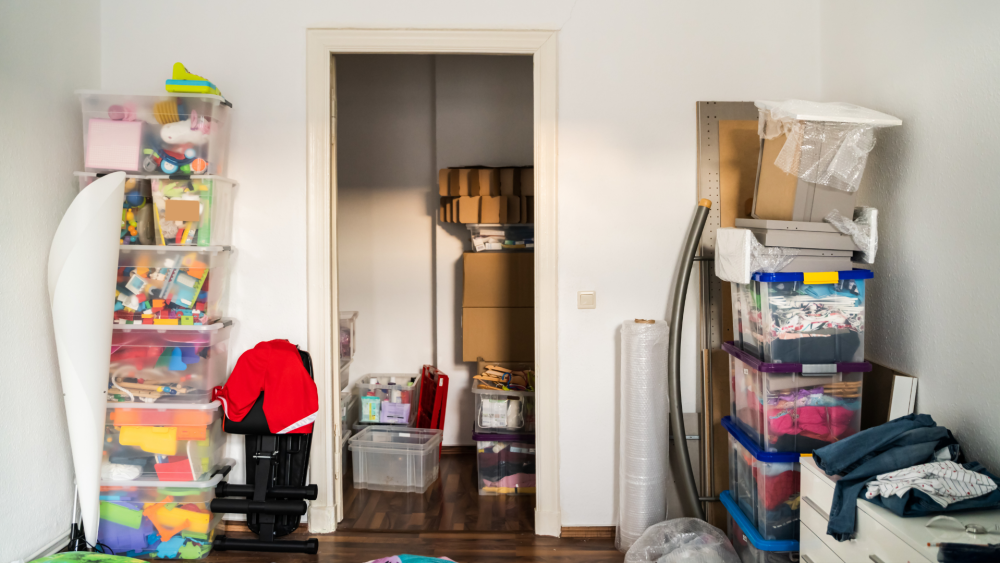 A room that has lots of things in clear storage containers for better organization.