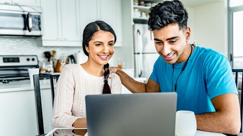 Young Indian couple doing home budget